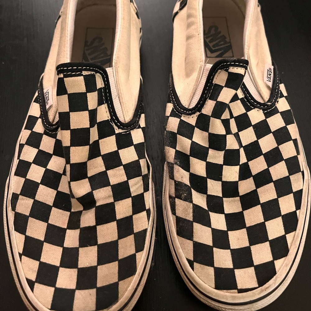 Vans checkered slip ons.